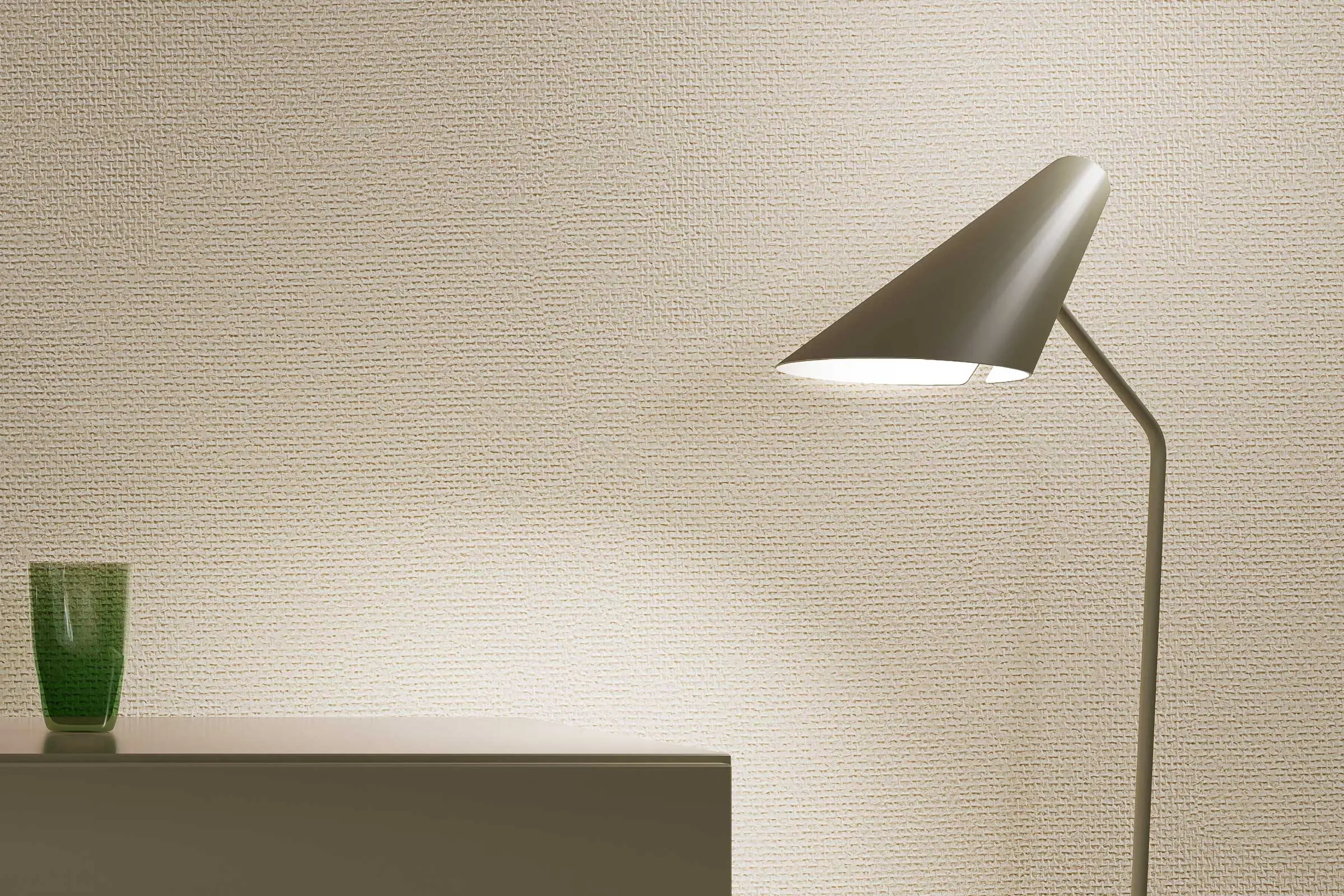 Dining area, close-up of lamp in front of wall painted in a beige colour shade from Sto’s Interior C